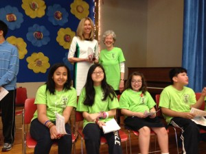 Luette Bourne, with Board Chair Virginia Goscinak prepares for the ceremony with award winners from previous years.