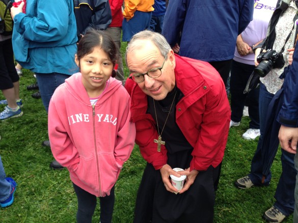 A faithful walker greets Bishop Tom Shaw as she prepares for the walk.